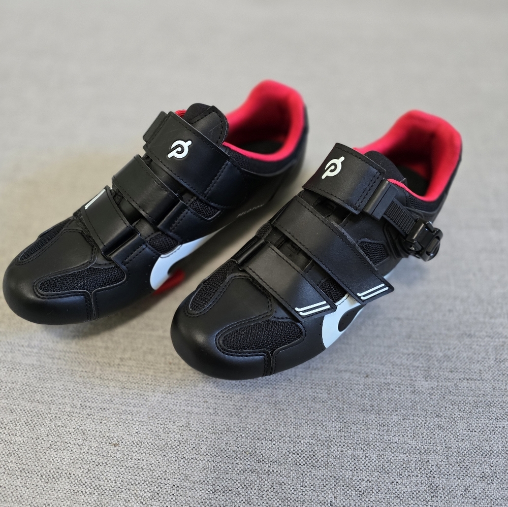 Peloton black, red, and white cycling shoes
